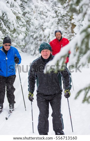 Seniors enjoy themselves cross country skiing in the winter on skis