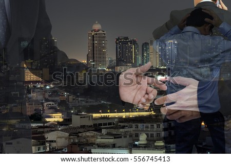 Double exposure of  Business man and city background .