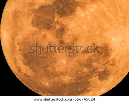 The yellow full moon on black background for your night and dark design concept. High Quality of full moon photo.