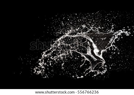 Water Splash On The Black background Royalty-Free Stock Photo #556766236
