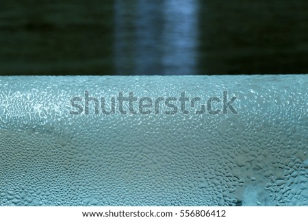 Close up drops water on wood background