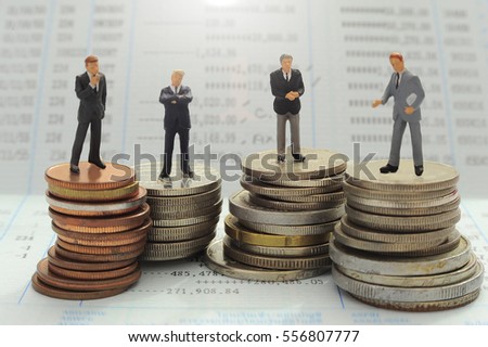 Business people over money background ,miniature people concept.