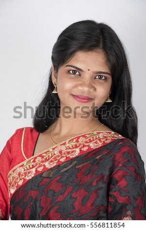 Portrait of beautiful Indian girl , Happy young beautiful traditional Indian woman in saree.