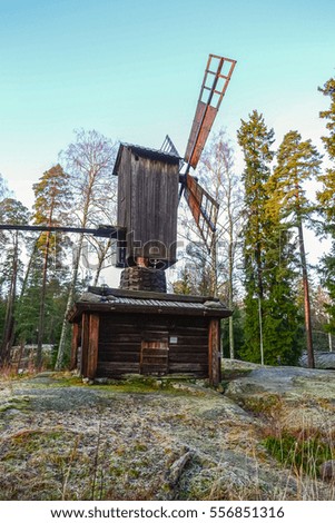 Old wooden mill in forest sunrise, Finland