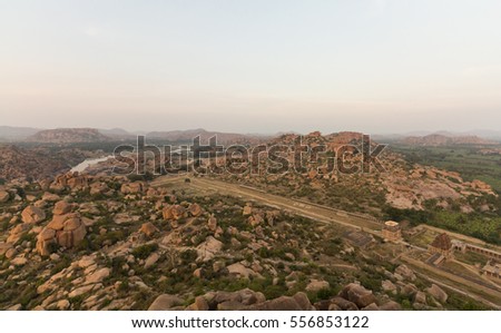 Ancient artisan's street and other remaining of Hampi, seen from Matanga parvata (Matanga hills). Tungabhadra river seen in the picture.