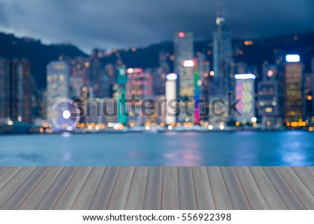 Opening wooden floor, Blurred lights Hong Kong city downtown abstract background
