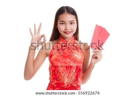 Asian girl in chinese cheongsam dress show OK with red envelope  isolated on white background.