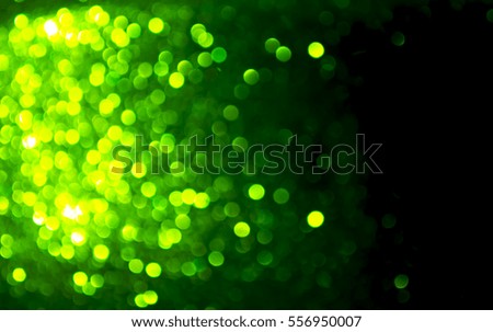 Abstract background with green blurred bokeh lights
