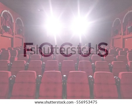 FOCUS words with blurred cinema background - movies and entertainment concept