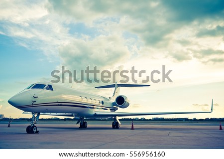 Airplane for business flights - retro vintage filter effect Royalty-Free Stock Photo #556956160