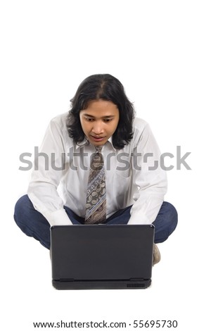 Long hair man sit on the floor, working with laptop, isolated on white background