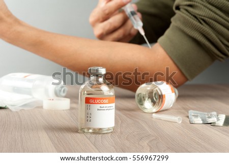 closeup vial of Glucose for Paranteral nutrition and for hypoglycemia. Royalty-Free Stock Photo #556967299