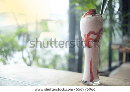 Strawberry yogurt  Smoothie Recipes (Vintage Style) on wood table with blurred background 
