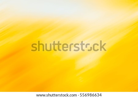Yellow and white diagonal motion blur texture for background Royalty-Free Stock Photo #556986634