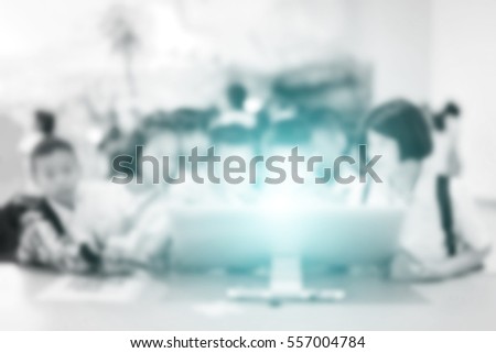 Blur student during study computer e-learning or test in the classroom. Soft focus picture grey tone. Blurred child learn studying group.