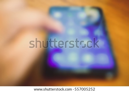 Blurred abstract background and can be illustration to article of hand use smartphone