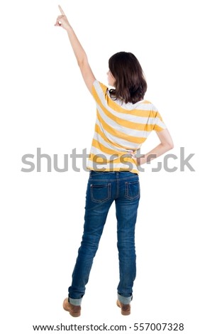 Back view of  pointing woman. beautiful brunette  girl in yellow striped t-shirt. Rear view people collection.  backside view of person.  Isolated over white background.