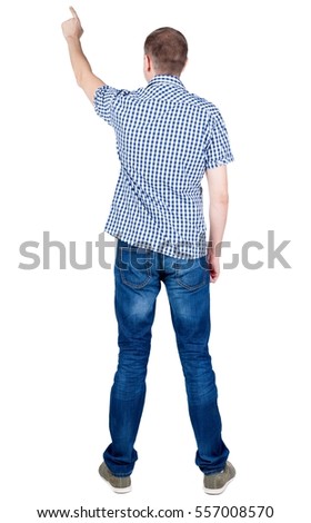 Back view of  pointing young men in  shirt and jeans. Young guy  gesture. Rear view people collection.  backside view of person.  Isolated over white background.
