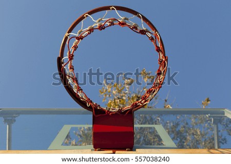 basketball hoop and ringboard with blue sky  