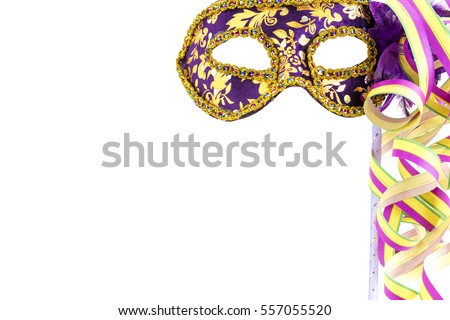 Violet carnival mask with streamers before a white background   