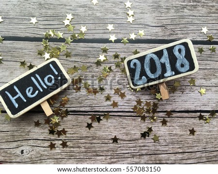 Hello 2018. 2018 wooden chalkboard and golden star with space for your logo.  
