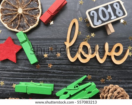 2018 love. Lovely 2018. 2018 wooden word love and chalkboard on black wooden background.  