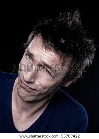 studio portrait on black background of a funny expressive caucasian man