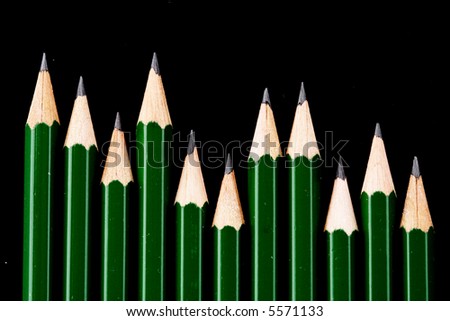 Green pencils isolated on black