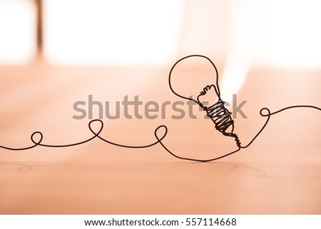 Idea concept image. Lightbulb made from black wire.Shallow depth of field..