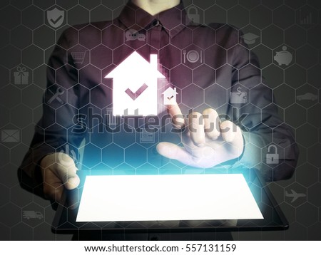 Image of a girl with tablet in her hands. She looking for a house for buying or for rent, using online searching service. Real estate. Online for buying or for rent.  