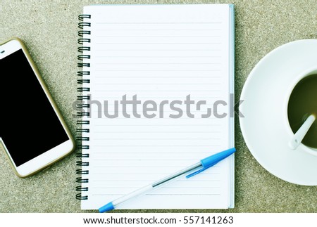 Modern white office desk table with laptop, smartphone and other supplies with cup of coffee.