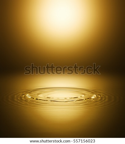 Ripple of the golden surface of the water Royalty-Free Stock Photo #557156023