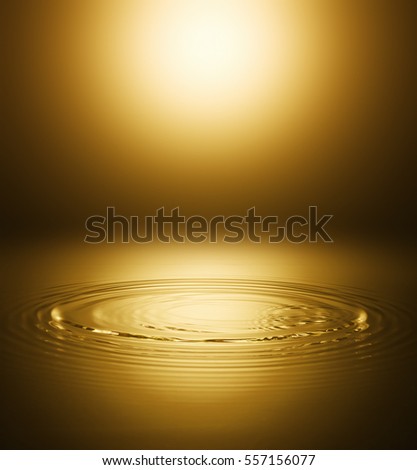 Ripple of the golden surface of the water Royalty-Free Stock Photo #557156077