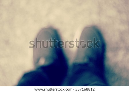 Blurred abstract background and can be illustration to article of Selfie of feet in red shoes