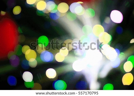 Christmas holiday background with empty wooden deck table over festive bokeh