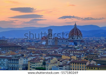 Duomo Santa Maria Del Fiore under the orange sky at dusk, Florence, Tuscany, Italy