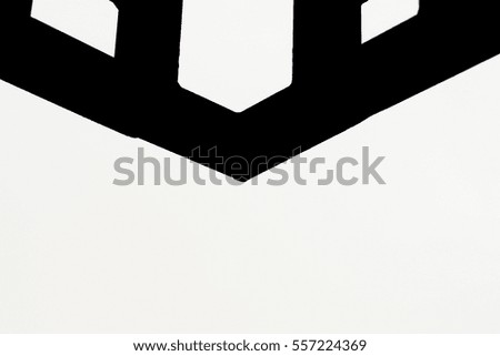 Black & white image of triangle shape in a part of the building steel.