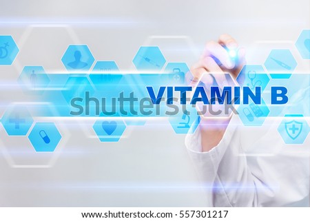 Medical doctor drawing vitamin b on the virtual screen.