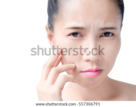 Beauty asian women worries freckles on her skin , studio photo