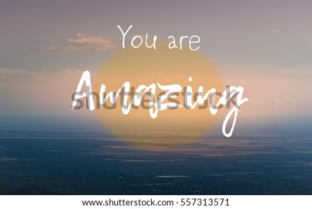 "You are amazing" text on aerial view of countryside. Positive message. Pastel colors.