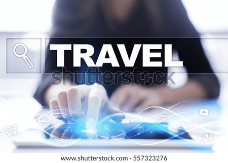 Woman using tablet pc and selecting travel .
