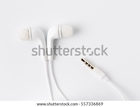 White earbuds with socket isolated on white background.