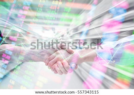 handshake business success with Blur supermarket interior for background