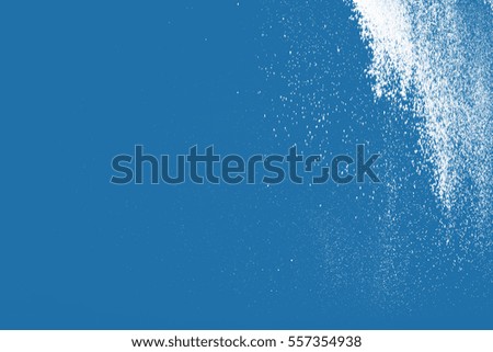 abstract white powder splatted on colored background. White powder explosion.