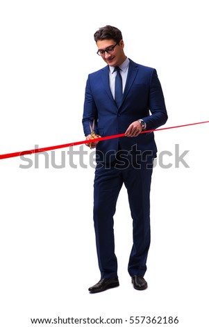 Businessman cutting red ribbon isolated on white