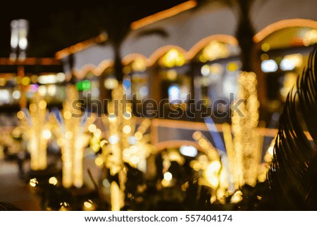 Blurry bokeh light background festive city evening outdoors illumination