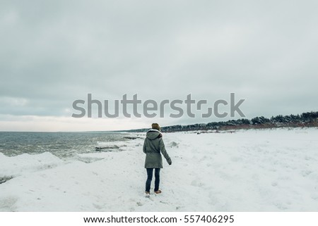 Seaside in winter, seashore, waves and ice in water time. Baltic sea. 