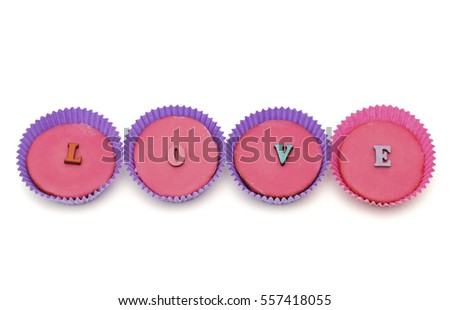 Four cupcakes withe the word love 