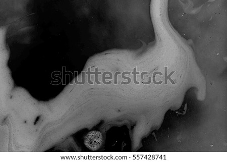 abstract background of  black ink dissolving in water