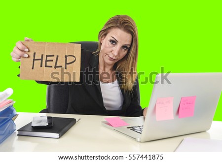 frustrated business woman in her 40s holding help sign desperate suffering stress overworked working at office laptop computer in sad  worried face expression isolated green chroma key screen